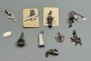 lot 89 image: Collection of 11 Vintage Sterling Silver Souvenir Charms