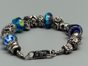 lot 110 image: Troll LAA Vintage 925 Sterling Silver Bracelet with 18 Glass Beads and Charms