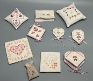 lot 162 image: Set of 12 embroidered fabric ornaments  Needle Cases & Sachets