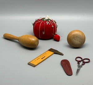 lot 210 image: Vintage Sewing Tools Set with Tomato Pincushion, Darning Eggs, and Scissors