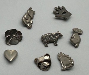 lot 223 image: Set of 8 Pewter MVB 84 Character buttons featuring Animal and Heart Designs