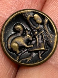 lot 237 image: Antique Brass Story Button with Unique SQUIRREL Scene Acorn Design