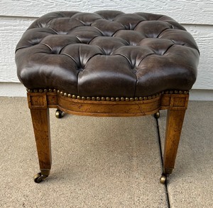 lot 343 image: Vintage MCM Tufted Leather Ottoman Stool with Brass Casters