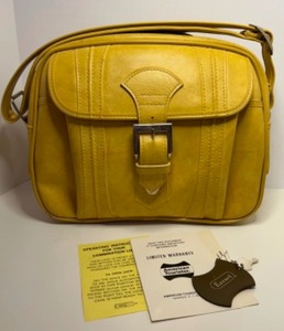 lot 355 image: Vintage American Tourister Escort Yellow Shoulder Bag with Lock and Papers