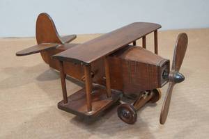 lot 123 image: Musical Wood Airplane