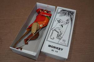 lot 124 image: Vintage Look Tin Litho Climbing Monkey