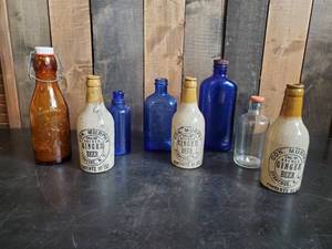 lot 23 image: Lot of Vintage Bottles Ginger Beer, Amber Glass Whole Milk Bottle, Blue Glass and more