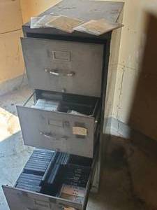 lot 34 image: Large Metal File Cabinet With DVDs of Various Tiles