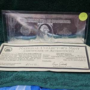 lot 2 image: 1999 $1 Silver Leaf Certificate with National Collectors Mint Certificate