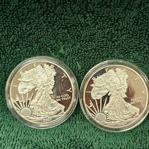 lot 69 image: 2-UNC 2020 Silver Eagles that are Fake-Copies