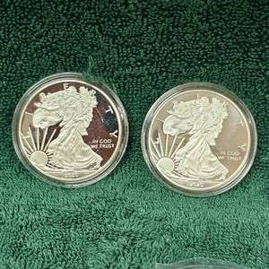 lot 82 image: 2-UNC 2020 Silver Eagle  Fake Copies