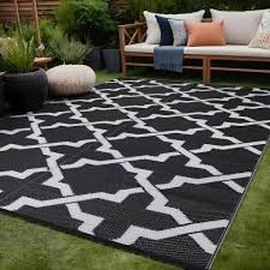 lot 24 image: Beverly Rug Lightweight Geometric BlackWhite 6 ft. x 9 ft. Reversible Plastic IndoorOutdoor Area Rug Customer Returns See Pictures