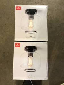 lot 48 image: Lot of Globe Electric 8 in. 1-Light Matte Black Flush Mount Ceiling Light with Clear Glass Shade     Customer Returns See Pictures