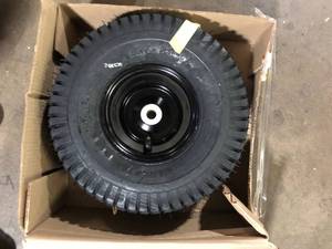 lot 56 image: Cub Cadet Original Equipment 15 in. Rider Front Wheel Assembly with Light Black Rim OEM# 634Z5149A  Customer Returns See Pictures