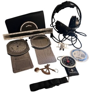 lot 85 image: Pilot Aviation Accessories Lot with Flight Computer, Headset, and Charts