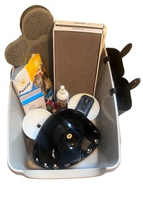 lot 107 image: Pet Care Kit with Bowls, Scratcher, Filters, and Accessories