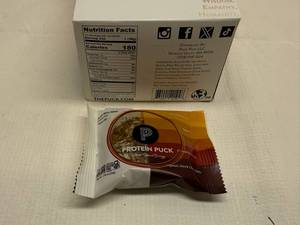 lot 84 image: 12x Protein Puck Daily Bliss Mini-Gluten FreeVegan
