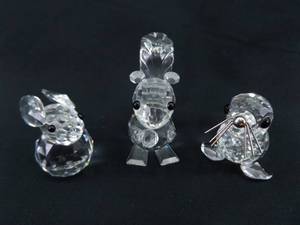 lot 15 image: Swarovski Seal, Bunny, and Squirrel Figurines