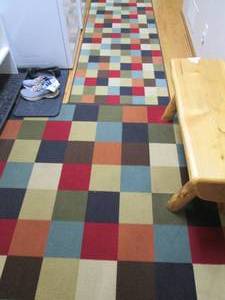 lot 237 image: Multi-color square 5x7ft area rug w...