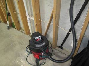 lot 101 image: 5-gallon Shop-Vac with hose and fla...