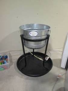 lot 104 image: Tall Metal pot style Planter with e...