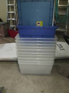 lot 145 image: Stack of plastic totes with covers...