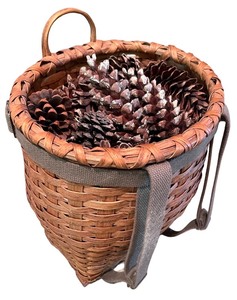 lot 56 image: Decorative Wicker Basket Backpack with Pine Cones