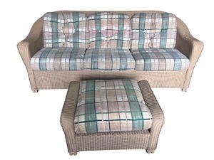 lot 4 image: Wicker Sofa with Matching Ottoman and Plaid Cushions