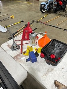 lot 15 image: TABLE FULL OF FUNNELS &  1 OIL CATCH PAN