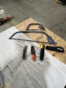 lot 167 image: TABLE FULL OF SAWS