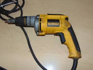 lot 76 image: DEWALT 6.3 Amp Corded Variable Speed Reversible Drywall Screw Gun