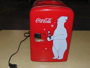 lot 82 image: Coca-Cola Polar Bear 4L CoolerWarmer 12V DC 110V AC Mini Fridge - Red Thermoelectric Dorm Refrigerator, 6 Can Capacity