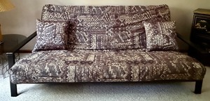 lot 18C image: Futon Sofa with Patterned Cushion and Two Pillows, 84 Inches Long