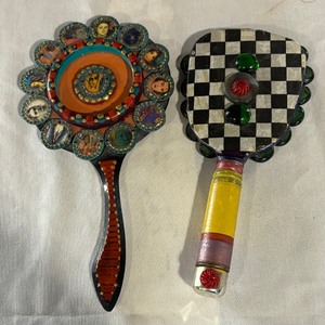 lot 34 image: Two Whimsical Hand Mirrors