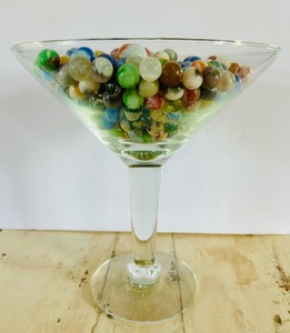 lot 161 image: Large Martini Glass Filled with Marbles