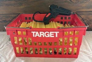 lot 243 image: Target Shopping Basket Almost Full of Glue Sticks with Dexter Hysol 2000-HP Glue Gun