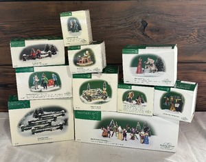 lot 93A image: Department 56 Village Accessories including These are for You, A Treasure from the Sea, Master Potter, Here We Come A-Wassailing and More