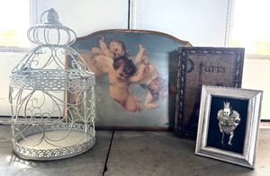 lot 356 image: Decorative Home Decor Lot with Cherub Art, Ornate Birdcage, and Framed Art