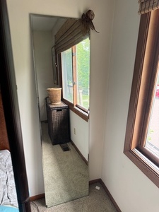 lot 39 image: Tall Rectangular Wall Mirror with Bow Accent