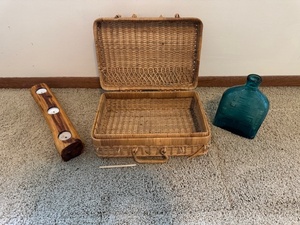 lot 109 image: Mixed Home Decor Lot Wicker Picnic Basket, Blue Glass Vase, and Wooden Candle Holder