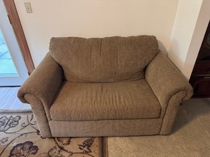 lot 118 image: Beige Upholstered Loveseat Sleeper Sofa