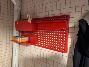 lot 146 image: Red Wall-Mount Metal Grid Organizer with Trays and Hooks