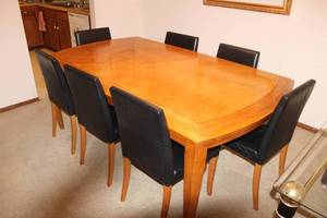 lot 1 image: Dining Table with 8 Black Upholstered Chairs