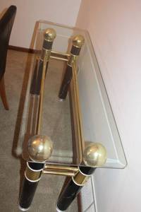 lot 2 image: Glass Top Console Table with Black and Gold Accents