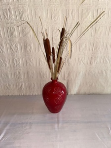 lot 239 image: Red Ceramic Vase with Embossed Floral Pattern and Dried Arrangement