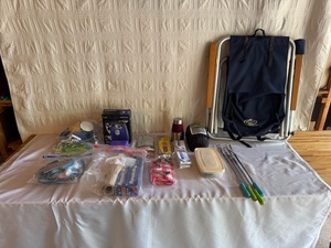 lot 271 image: Camping Gear Collection with Chair, Grill Forks, Sleeping Bag, and Accessories