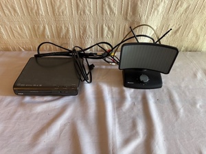lot 290 image: RCA DVD Player with Remote and Recoton TV Antenna