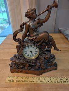 lot 9 image: Antique Cast Metal Mantle Clock with Lady and Horn Figure