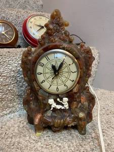 lot 14 image: Vintage Electric Mantel Clock with Decorative Cherub Detail