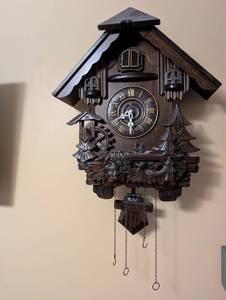 lot 32 image: Vintage Wooden Cuckoo Clock with Carved Forest Scene